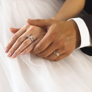 Hands of wedding couple